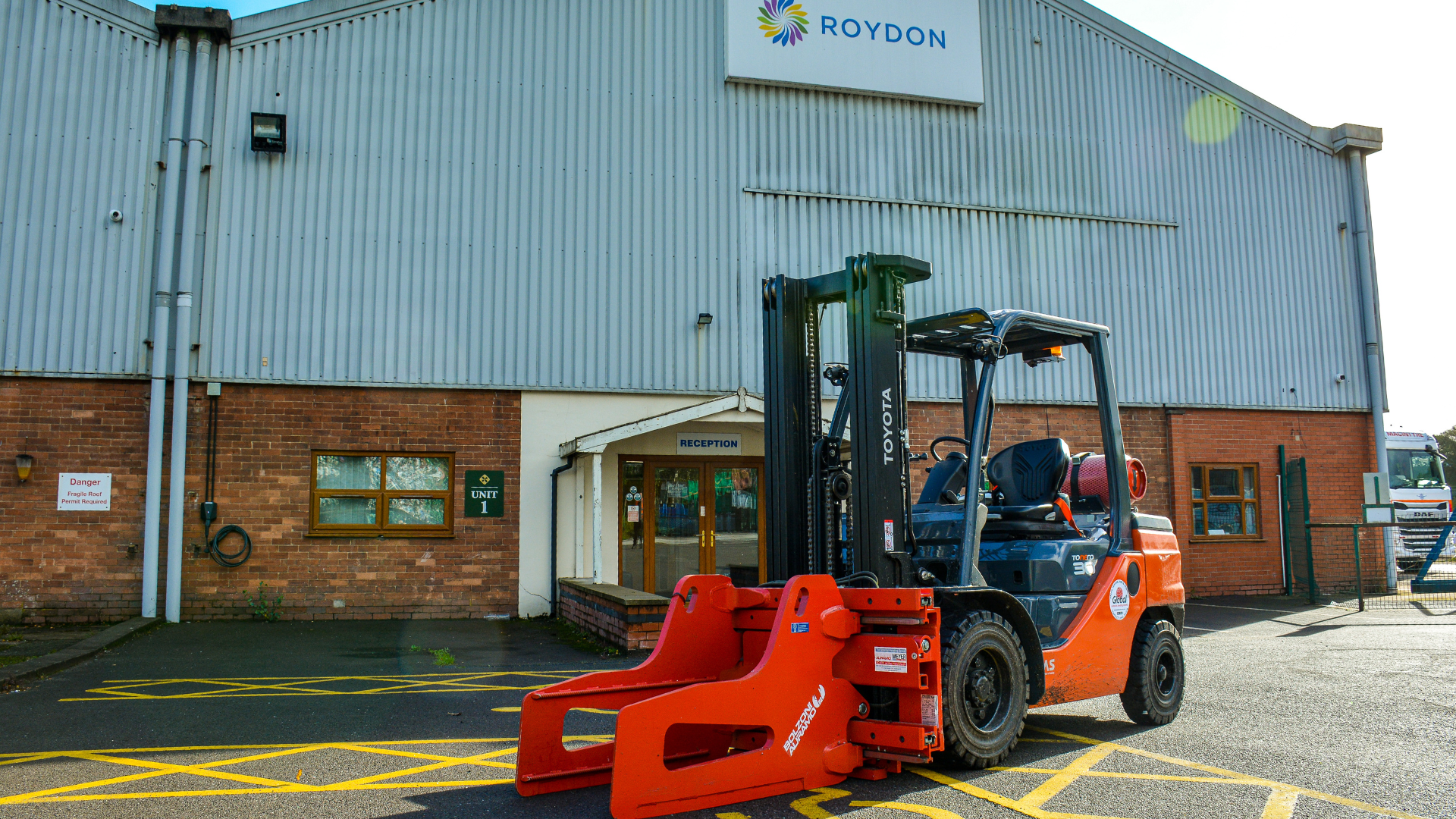 Toyota Forklift in front of Royden Image of Toyota Forklift in front of Roydon sign