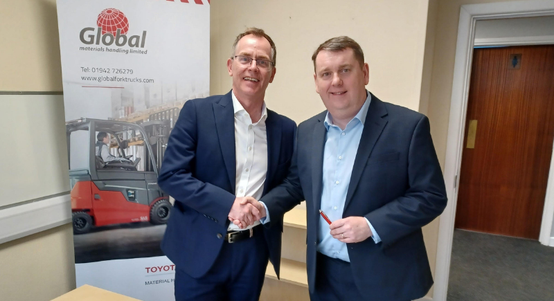 Photo of Toyota's Nick Duckworth (left) and Global's Andy Evans (right) as Global Materials Handling Become the Official Toyota Dealer for the North West of England